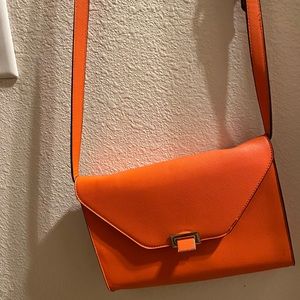 A orange shoulder bag